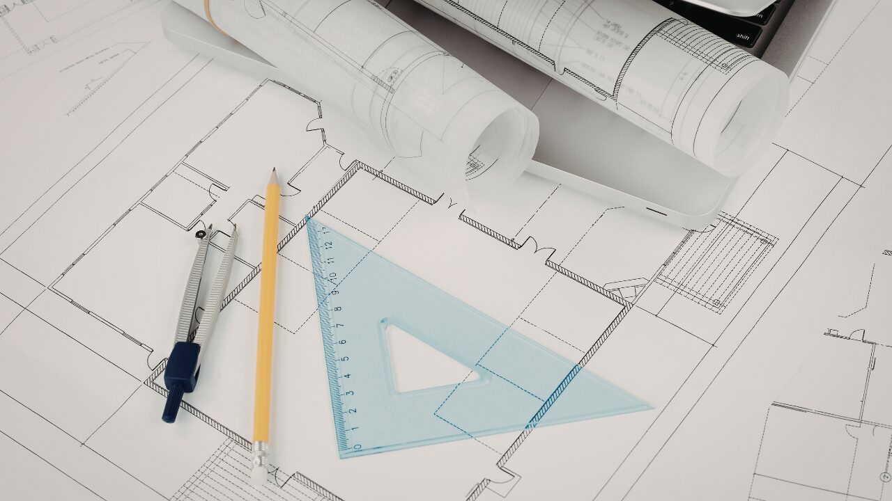 Architectural blueprints and drafting tools by A1 Houseplans draughting company