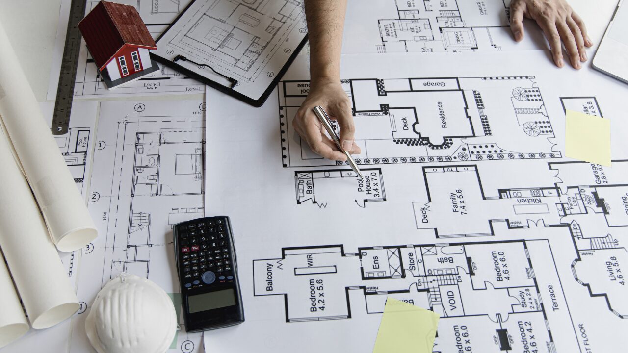 Architect checking house plans for accuracy and detail
