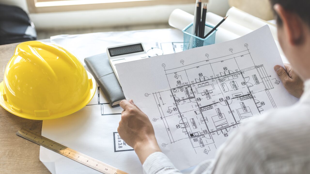 Architect reviewing architectural house plans